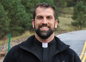 Rev. Dr. Ross Johnson smiling outdoors